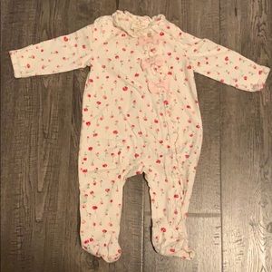 Kate Spade baby girl onesie with floral print.
